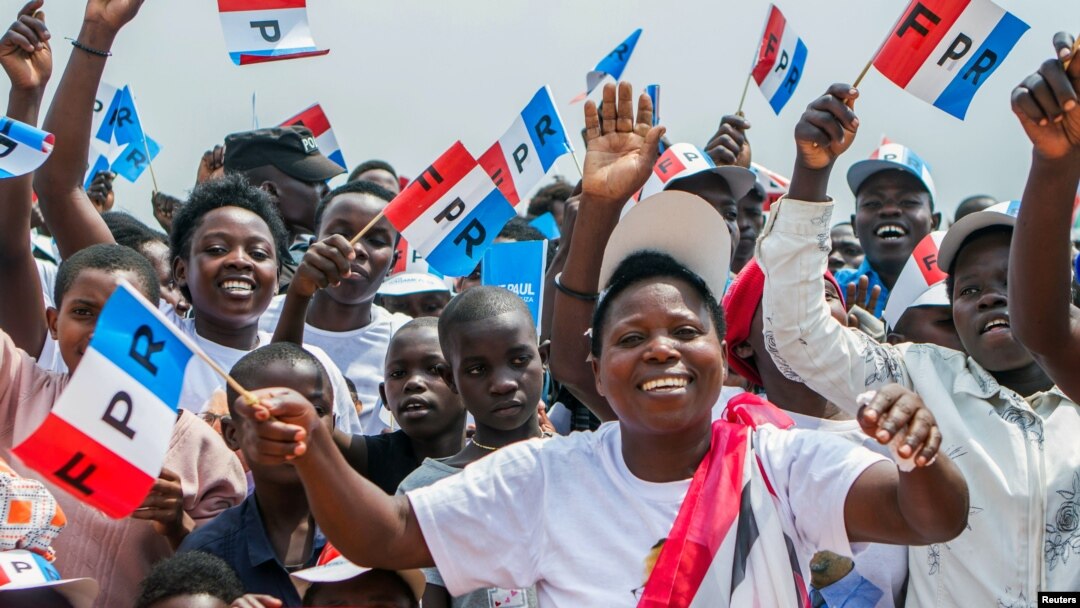 FILE - Supporters of the ruling Rwandan Patriotic Front (RPF) cheer during a rally by Rwandan President Paul Kagame in Nyanza, Rwanda, July 14, 2017.