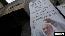 A banner promoting World Youth Day is seen at the Chapel of Sao Jeronimo, where Pope Francis is expected to visit during his upcoming trip to Varginha slum in Rio de Janeiro,Brazil, July 16, 2013.