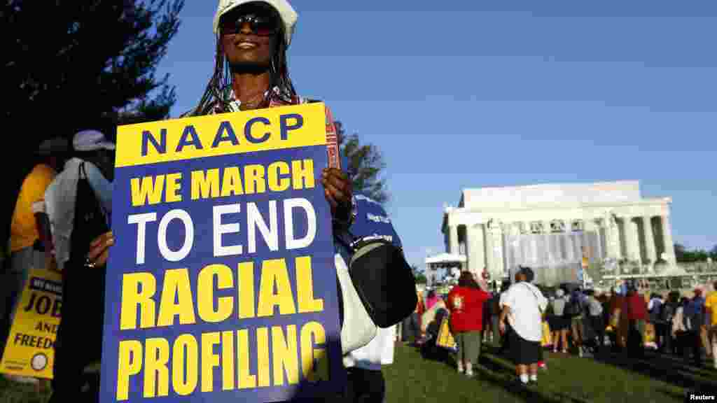 Marchers gather along the reflecting pool on the National Mall during the 50th anniversary of the 1963 March on Washington for Jobs and Freedom at the Lincoln Memorial in Washington Aug. 24, 2013. 