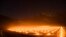 Anti-frost candles burn in a vineyard in Flaesch, in the Swiss canton of Grisons. Due to unseasonally low temperatures, wine growers are attempting to protect their grape shoots with additional warmth from the anti-frost candles.