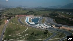 FILE - This view of Deodoro Olympic Park shows a canoe slalom circuit, center, and BMX circuit, right, during a flight over Rio de Janeiro, Brazil, April 6, 2016.