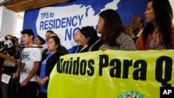 U.S. citizen Benjamin Zepeda, 14, at podium, with his mother, Lorena Zepeda, right, who benefits from Temporary Protected Status, addresses a news conference in Los Angeles, Jan. 8, 2018. The Trump administration said Monday that it would end special protections for Salvadoran immigrants, an action that could force nearly 200,000 to leave the U.S. by September 2019 or face deportation.