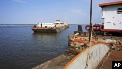 A barge with food and other imports arrives at the Nile port of Kosti at White Nile State, South Sudan, September 21, 2011.