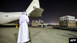 Humanitarian aid provided by the United Nations is loaded onto a United Arab Emirates Air Force C-130H-30 Hercules turboprop military transport aircraft at Dubai International Airport before departure for Cairo on Oct. 19, 2023.