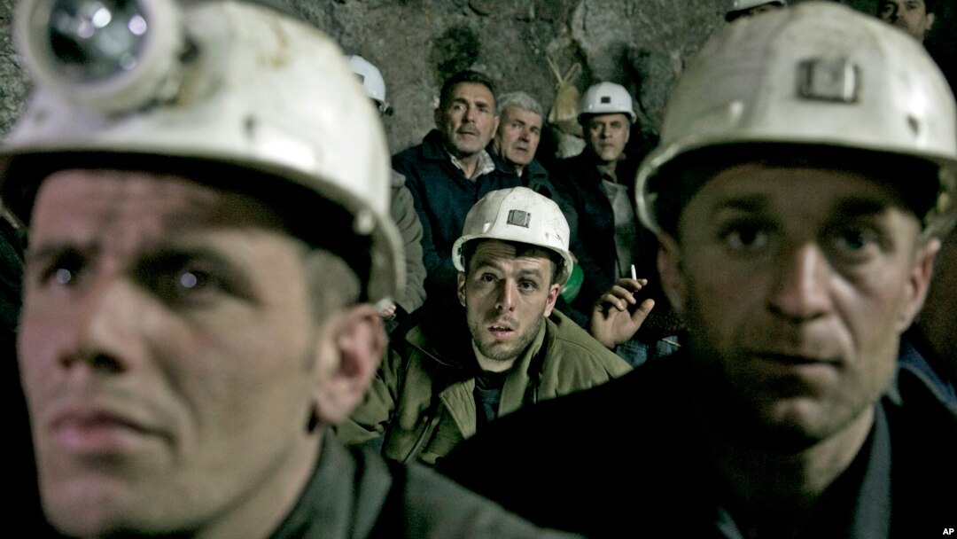 Miners from the Trepca mining complex, sit during a strike, inside the Stari Trg mine, in Kosovo, Jan. 21, 2015. 