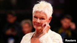 Actor Judi Dench poses during a turn on the red carpet for the movie "Victoria and Abdul" at the 74th Venice Film Festival in Italy, Sept. 2017.