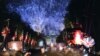 Spectators on The Mall watch a firework display and beacon lighting at Buckingham Palace following the Diamond Jubilee concert in London June 4, 2012. 