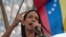 La candidata presidencial opositora, María Corina Machado, ofrece un discurso a sus seguidores durante una actividad para conmemorar los 66 años del derrocamiento del dictador Marcos Pérez Jiménez. 