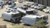 FILE - Zimbabwean riot police with water cannons are seen parked in Harare, Oct. 11, 2018. Lawyers say police in the country have arrested dozens of trade union members ahead of a planned protest in the capital over the worst economic crisis in a decade.