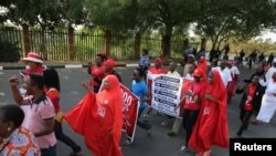 FILE - Members of the #bringbackourgirls campaign rally in Nigeria's capital, Abuja, to mark 1,000 days since over 200 schoolgirls were kidnapped from their secondary school in Chibok by Islamist sect Boko Haram, Jan. 8, 2017.