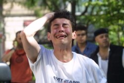 A man cries on Sept. 11, 2001 after witnessing the collapse of the north tower of the World Trade Center in New York City.