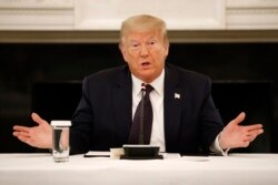 FILE - President Donald Trump speaks during a round-table discussion with law enforcement officials, June 8, 2020, at the White House in Washington.