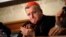 FILE - Cardinal Raymond Burke applauds at the Italian Senate, in Rome, on Sept. 6, 2018. Pope Francis has taken measures to punish Burke, one of his highest-ranking critics, by yanking his right to a Vatican apartment and salary. 