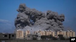 FILE—Smoke rises following an Israeli airstrike in the central Gaza Strip, March 22, 2024.