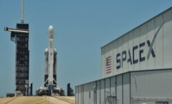 FILE PHOTO: A SpaceX Falcon Heavy rocket, carrying the U.S. Air Force’s Space Test Program-2 mission, is shown during launch preparation at the Kennedy Space Center in Cape Canaveral.