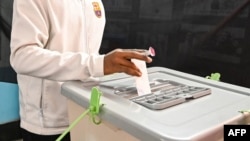 A man casts his ballot at a polling station during Bangladesh's general elections in Dhaka on Jan. 7, 2024. Bangladesh, where Sheikh Hasina won a fifth term as prime minister, kicked off a year in which billions of people will vote in national elections.