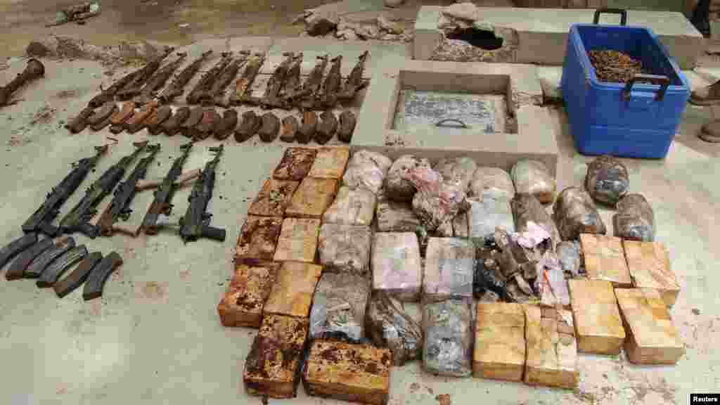 Ammunition and explosives seized from suspected members of Hezbollah are displayed after a raid of a building in Nigeria's northern city of Kano May 30, 2013.