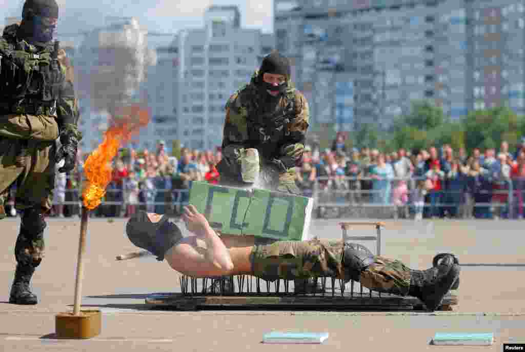Belarusian paratroopers perform during celebrations marking the 90th anniversary of the airborne troops in Minsk, Aug. 1, 2020.