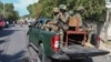 Soldiers patrol a street in Port-au-Prince, Haiti, Dec. 2, 2024.