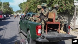 Soldiers patrol a street in Port-au-Prince, Haiti, Dec. 2, 2024.