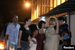 Family members arrive to see the body of 15-year-old Irish girl Nora Anne Quoirin at Tuanku Jaafar Hospital in Seremban, Malaysia, Aug. 13, 2019.