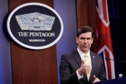 U.S. Defense Secretary Mark Esper gestures as he speaks during a joint news conference with Britain's Secretary of State of Defense Ben Wallace after their meeting at the Pentagon, March 5, 2020.