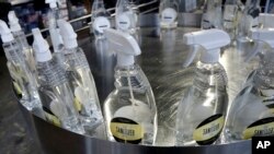 Bottles of hand sanitizer made at Tattersall Distilling on March 24, 2020, in Minneapolis sit ready for packaging.