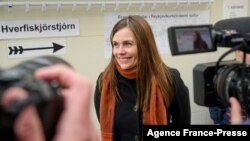 FILE - Iceland's Prime Minister Katrin Jakobsdottir speaks to the media at a polling station in Iceland's capital Reykjavik, Sept. 25, 2021, during the country's parliamentary elections.