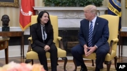 President Donald Trump meets with Aya Hijazi, an Egyptian-American aid worker, in the Oval office of the White House in Washington, April 21, 2017.