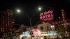 Two men walk past the El Cortez hotel-casino in downtown Las Vegas, Wednesday, Nov. 11, 2020. (AP Photo/Wong Maye-E)