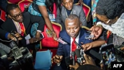 FILE - Vital Kamerhe, president of the opposition Citizen Front Party (C) speaks to the media during the opening of a Congolese "National Dialogue" in the Democratic Republic of Congo's capital Kinshasa, Sept. 1, 2016.