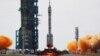 The Long March-2F Y12 rocket, carrying the Shenzhou-12 spacecraft and three astronauts, takes off from Jiuquan Satellite Launch Center for China's first manned mission to build its space station, near Jiuquan, Gansu province, China June 17, 2021. 