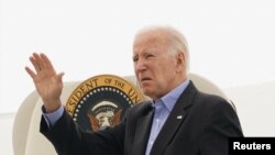 U.S. President Joe Biden waves as he departs for Maui from Reno, Nevada, U.S., August 21, 2023