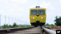 In this photo taken Wednesday, Oct. 20, 2010, a service train operated by Toll Royal Cambodia passes over a river, just south of the Cambodian capital Phnom Penh. An Australian joint venture has a 30-year lease to upgrade and operate Cambodia's railway, p