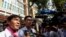 Uon Chhin and Yeang Sothearin, former journalists from the U.S.-funded Radio Free Asia (RFA), who have been charged with espionage, speak to the media in front of the Municipal Court of Phnom Penh, Cambodia, Oct. 3, 2019. 