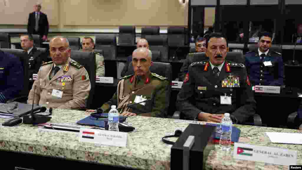 From left, Egypt Lieutenant General Mahmoud Hegazy, Iraq General Babakir Zebari and Jordan General Mashal Al-Zaben listen attend a meeting with more than 20 foreign defense chiefs to discuss U.S.-led coalition efforts in the campaign against Islamic Stat