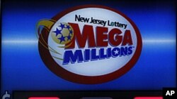 A storefront sign displays the jackpot total of Mega Millions lottery in Hoboken, New Jersey, March 30, 2012. 