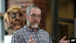 Instructor Chris Powicki speaks during an interview at Cape Cod Community College in West Barnstable, Mass, Aug. 21, 2019. 