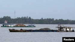 Ships transport sand on Mekong river in Can Tho city, Vietnam, Dec. 16, 2018. 