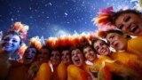 Performers pose after the end of closing ceremony of the London 2012 Olympic Games at the Olympic stadium August 12, 2012. 