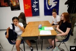 FILE - Students attend an eight grade class at Southside Middle School in Denham Springs, Lousiana.