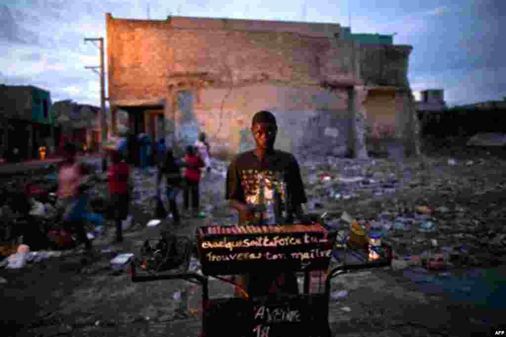 A hot dog vendor works in downtown Port-au-Prince, Haiti, Friday Oct. 8, 2010. (AP Photo/Ramon Espinosa)