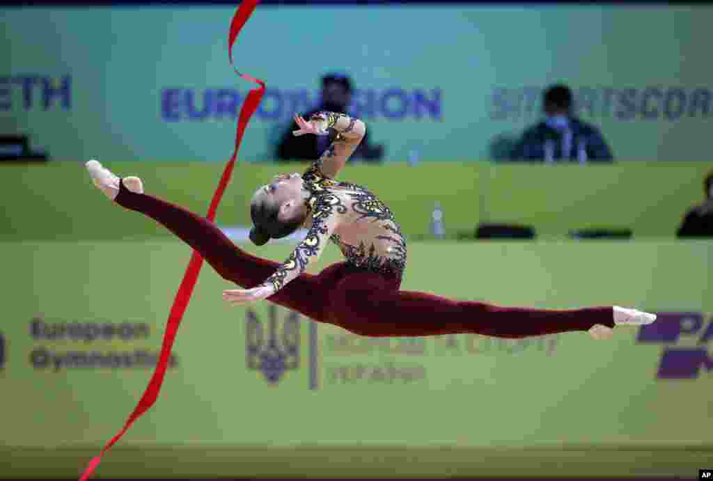 Vlada Nikolchenko of Ukraine performs with the ribbon during the 36th European Rhythmic Gymnastics Championships in Kyiv.