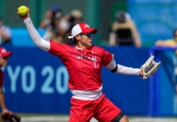 Japan's Yukiko Ueno pitches during the softball game between Japan and Australia at the 2020 Summer Olympics, Wednesday, July 21, 2021, in Fukushima, Japan. (AP Photo/Jae C. Hong)