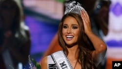 Pakistani laborers work on a bridge as the sun sets in Islamabad.