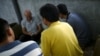 FILE - Chinese dissidents, who asked not to be identified, speak during an interview with Reuters in Bangkok, Feb. 2, 2016. 