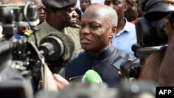 Guinea Bissau's president Jose Mario Vaz speaks to medias at a polling station in Bissau on March 10, 2019, during the legislative elections in Guinea Bissau.
