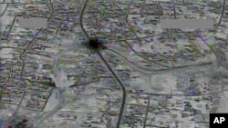 This image made from gun-camera video taken on July 4, 2015, and released by United States Central Command shows an airstrike on a main road and transit route near the Islamic State group-held Raqqa, Syria.