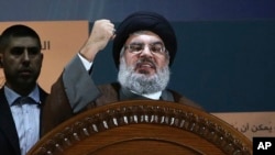 ARCHIVO - El líder de Hezbollah, Hassan Nasrallah, habla durante una manifestación para conmemorar el día de Jerusalén, en el suburbio sur de Beirut, el 2 de agosto de 2013. (Foto AP/Hussein Malla, archivo)