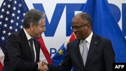 U.S. Secretary of State Antony Blinken (L) shakes hands with Cabo Verde Prime Minister Ulisses Correia e Silva (R) at the Government Palace in Praia, Cape Verde, on January 22, 2024.